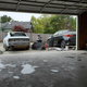 Pulled everything outside, then a half-assed attempt to wash away the bodywork dust .